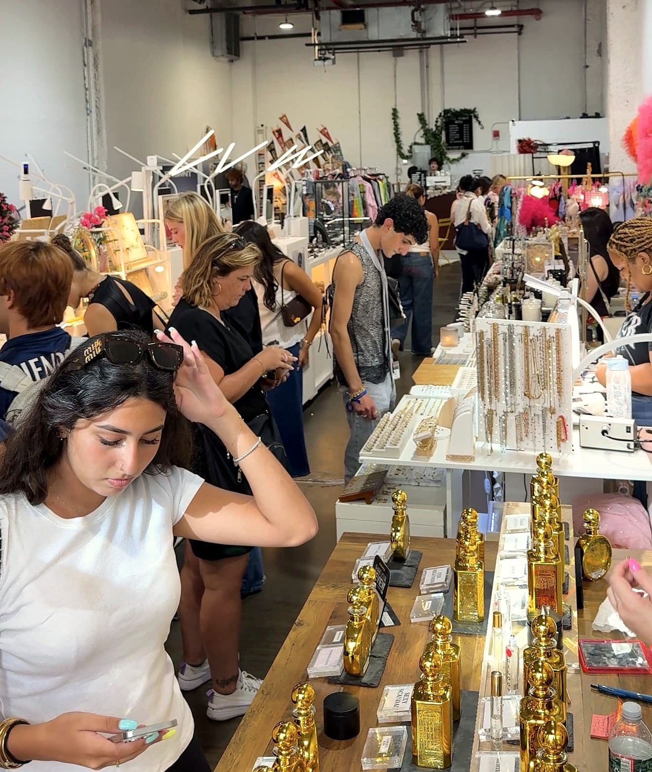 Shoppers at the jewelry tables