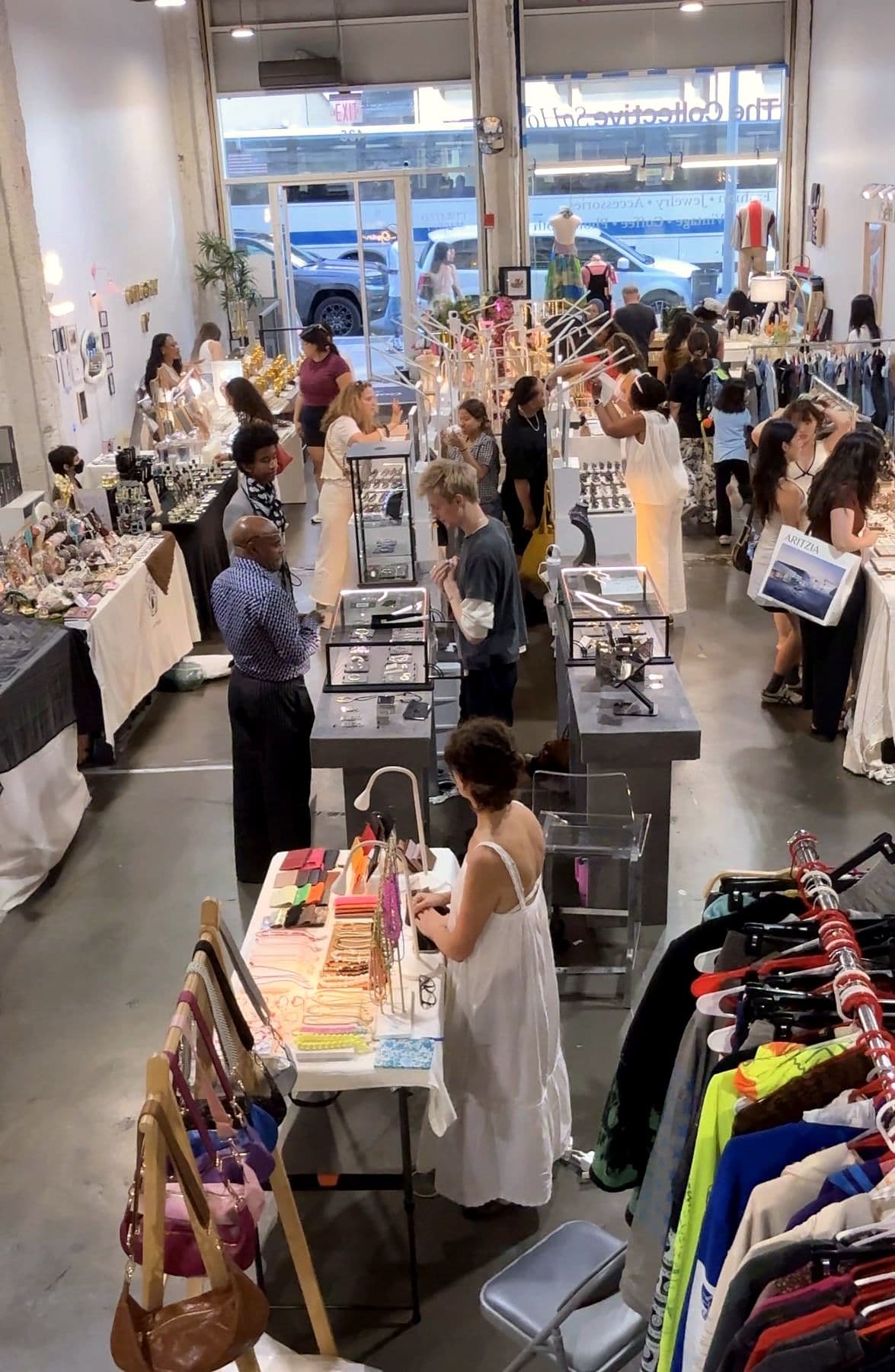 Shoppers browsing the main aisle at The Collective SoHo